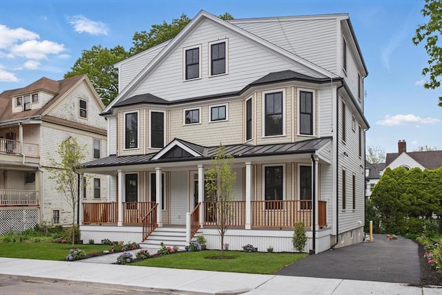 61 Lyndhurst St Unit A, Boston, MA 02124 - view of front facade with covered porch, a standing seam roof, and metal roof