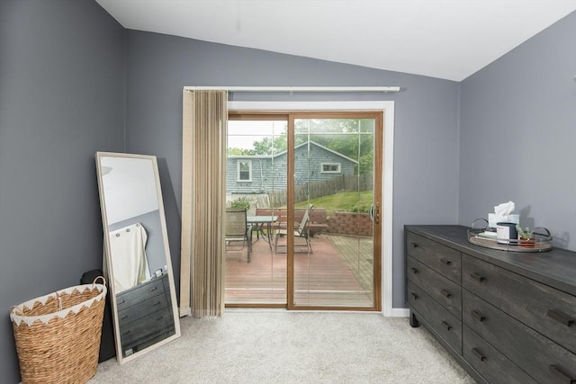 38 Colonial Rd, Weymouth, MA 02191 - doorway with lofted ceiling, light carpet, and baseboards