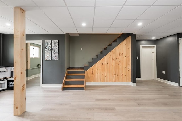 38 Colonial Rd, Weymouth, MA 02191 - basement featuring stairway, baseboards, light wood-style floors, a drop ceiling, and recessed lighting