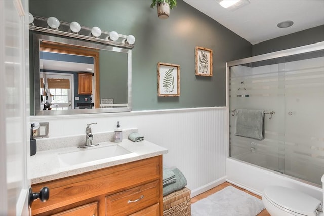 38 Colonial Rd, Weymouth, MA 02191 - full bath featuring vanity, toilet, enclosed tub / shower combo, and wainscoting