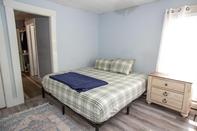 bedroom featuring wood finished floors