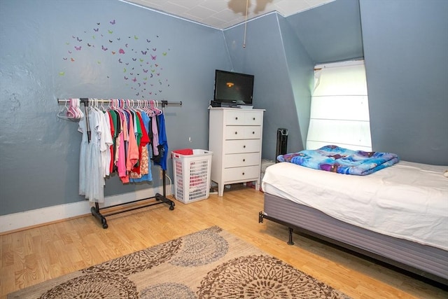 bedroom with wood finished floors