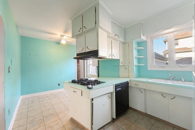 kitchen with white cabinets, sink, black dishwasher, and a wealth of natural light