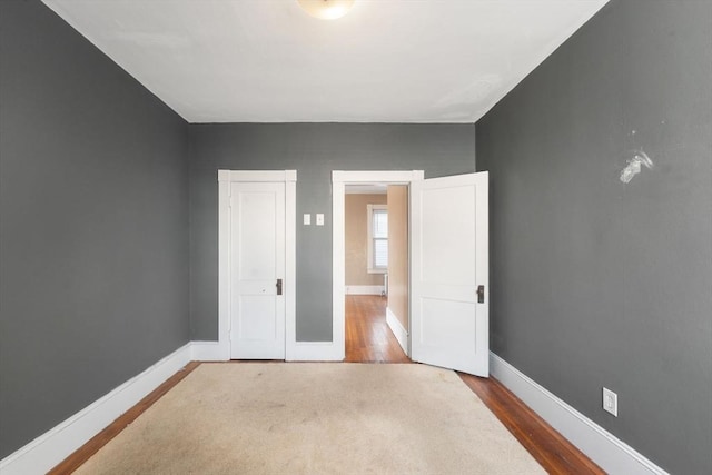 spare room with hardwood / wood-style flooring