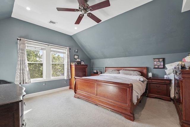 carpeted bedroom with vaulted ceiling and ceiling fan