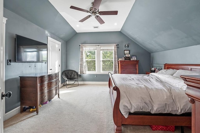 carpeted bedroom featuring ceiling fan and vaulted ceiling