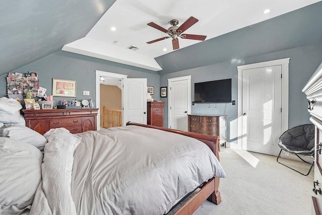 carpeted bedroom with vaulted ceiling and ceiling fan