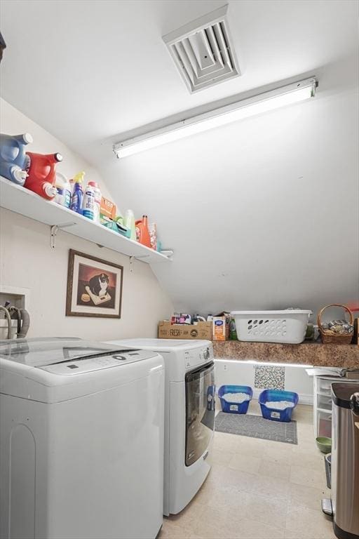 washroom featuring washer and dryer