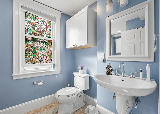 bathroom featuring tile patterned flooring and toilet