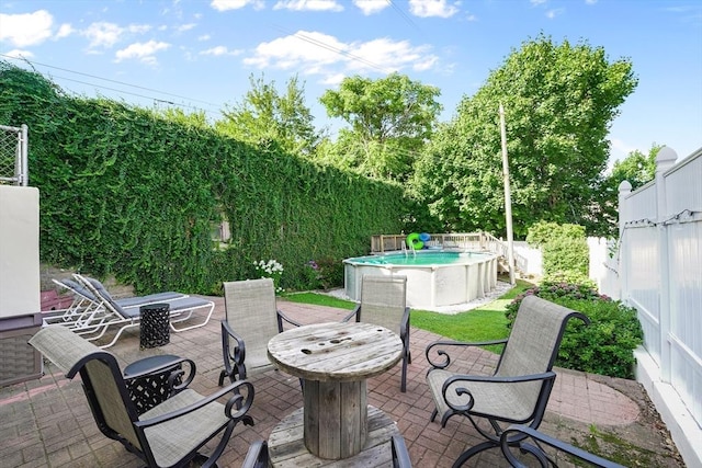 view of patio / terrace featuring a fenced in pool