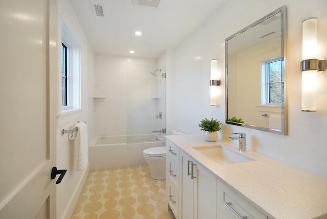 full bathroom with vanity, toilet, and shower / tub combination