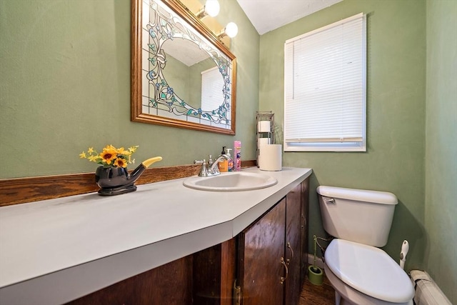 141 Pleasant St Unit 7, Attleboro, MA 02703 - bathroom featuring vanity, toilet, and baseboard heating