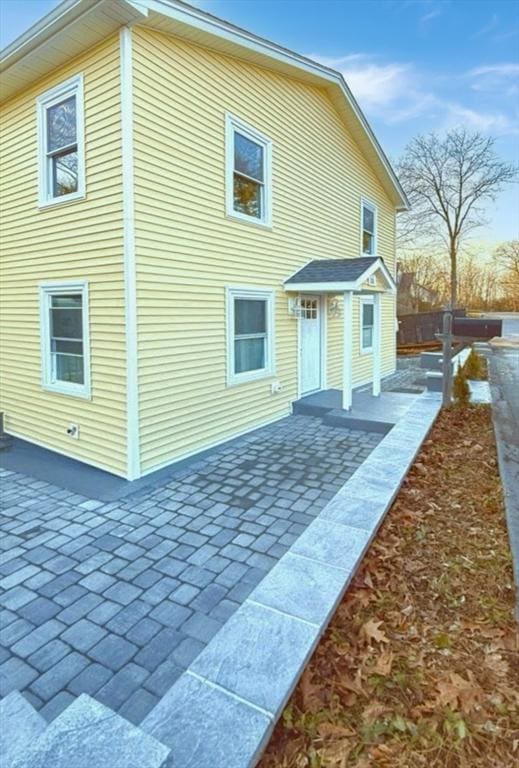 rear view of property featuring a patio area