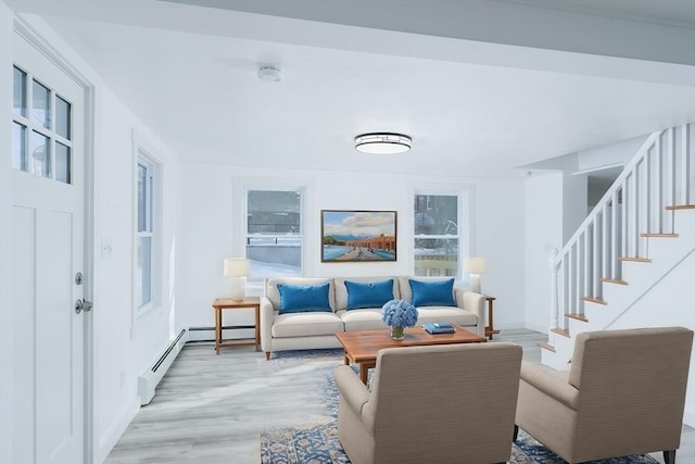 living room featuring a baseboard radiator and light wood-type flooring