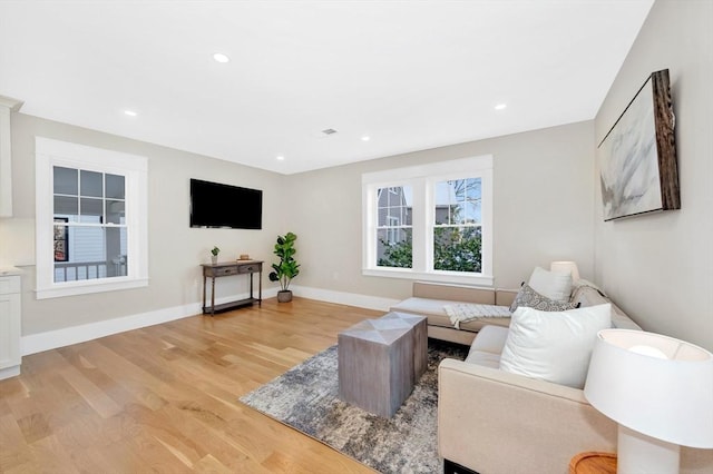 living room with light hardwood / wood-style floors