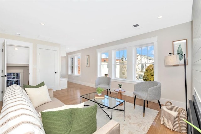 living room with light hardwood / wood-style floors