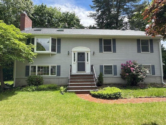 2 Robert Cohen Dr, Canton, MA 02021 - split foyer home with a front yard and a chimney