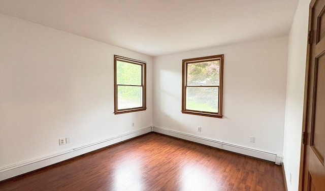 2 Robert Cohen Dr, Canton, MA 02021 - empty room with healthy amount of natural light, dark wood-type flooring, and a baseboard radiator