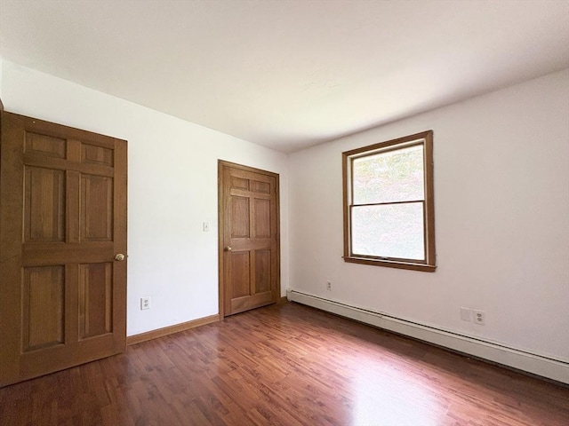 2 Robert Cohen Dr, Canton, MA 02021 - unfurnished bedroom with a baseboard radiator, wood finished floors, and baseboards