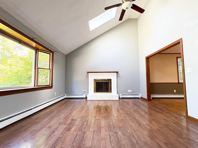 2 Robert Cohen Dr, Canton, MA 02021 - unfurnished living room with a baseboard heating unit, ceiling fan, a skylight, and high vaulted ceiling