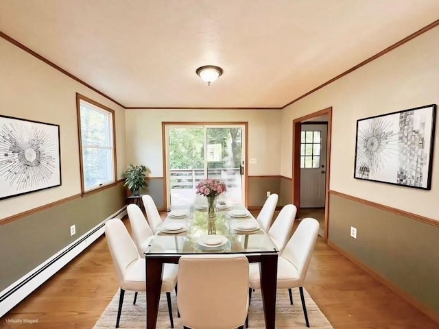 2 Robert Cohen Dr, Canton, MA 02021 - dining area with a baseboard heating unit, ornamental molding, and wood finished floors