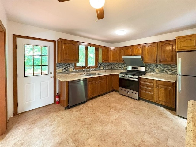 2 Robert Cohen Dr, Canton, MA 02021 - kitchen featuring stainless steel appliances, under cabinet range hood, healthy amount of natural light, and a sink