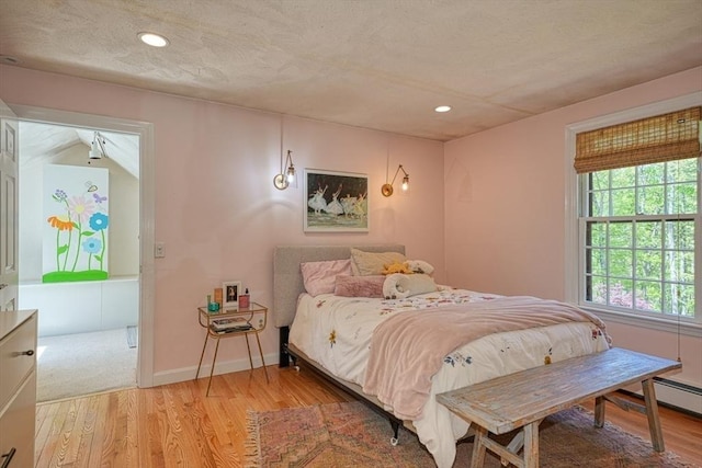 bedroom featuring light wood finished floors, recessed lighting, and baseboards