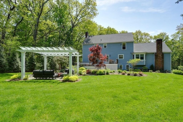 back of house with a chimney, a pergola, a lawn, and an outdoor living space