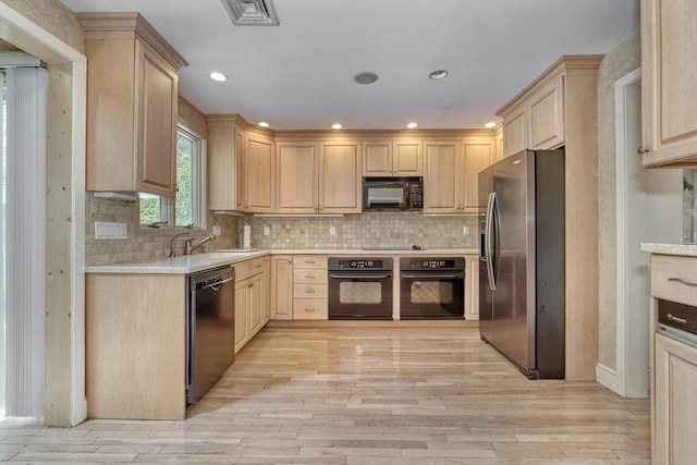 68-70 Floyd St, Winthrop, MA 02152 - kitchen with light wood-style floors, light brown cabinets, and black appliances