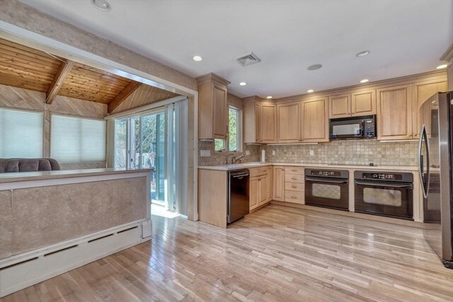 68-70 Floyd St, Winthrop, MA 02152 - kitchen featuring backsplash, visible vents, light countertops, a baseboard radiator, and black appliances