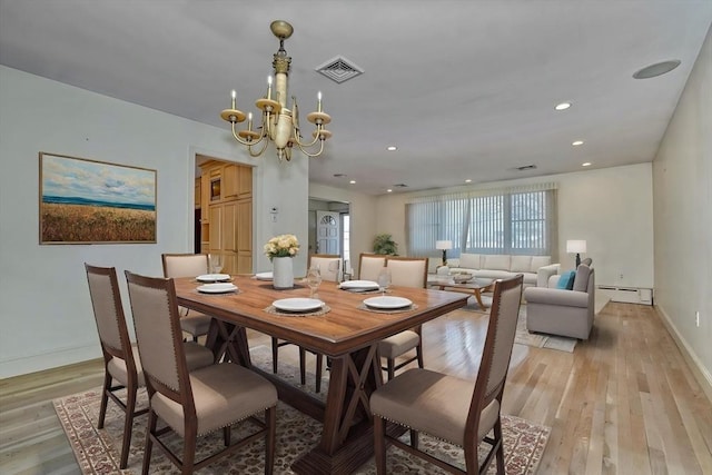 68-70 Floyd St, Winthrop, MA 02152 - dining space featuring an inviting chandelier, visible vents, baseboards, light wood-type flooring, and a baseboard heating unit