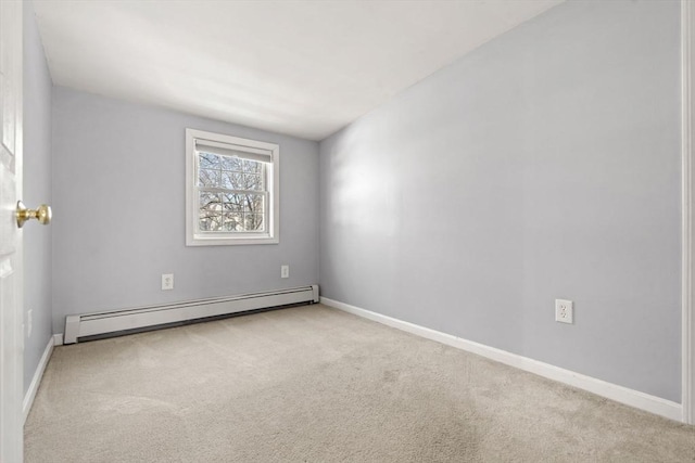 empty room with baseboards, carpet floors, and a baseboard radiator