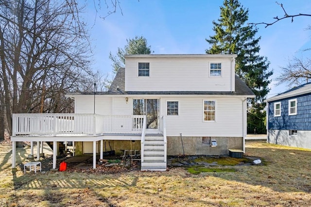 back of house featuring a wooden deck and stairs