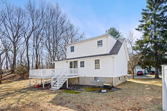 back of property featuring stairway and a deck