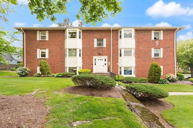 82 Neponset St Unit E, Canton, MA 02021 - view of front facade with a front lawn and brick siding