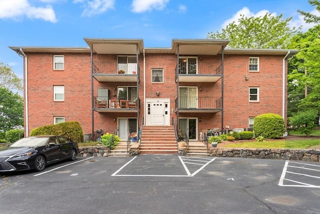 82 Neponset St Unit E, Canton, MA 02021 - view of building exterior featuring uncovered parking