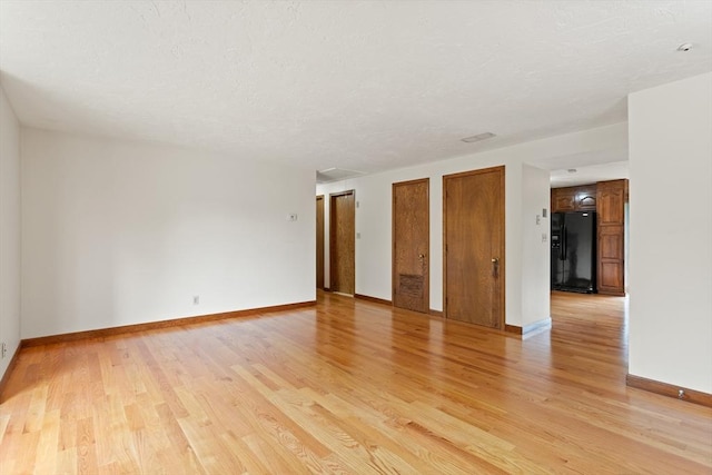 82 Neponset St Unit E, Canton, MA 02021 - empty room with light wood-style floors and baseboards
