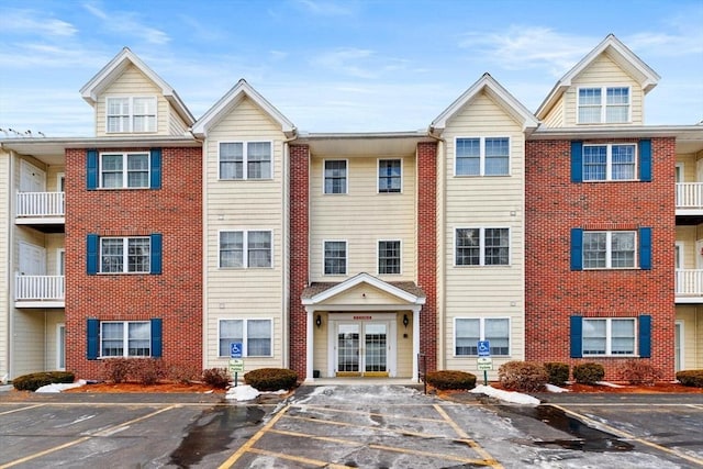 view of property with uncovered parking