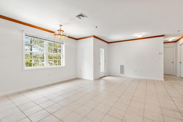 empty room featuring ornamental molding, visible vents, baseboards, and an inviting chandelier