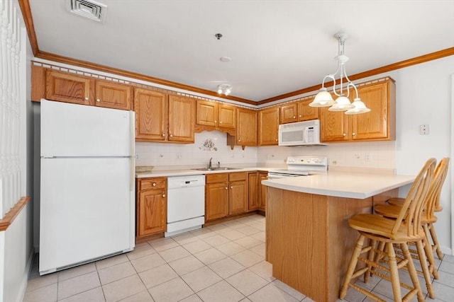 kitchen with white appliances, tasteful backsplash, ornamental molding, visible vents, and a sink