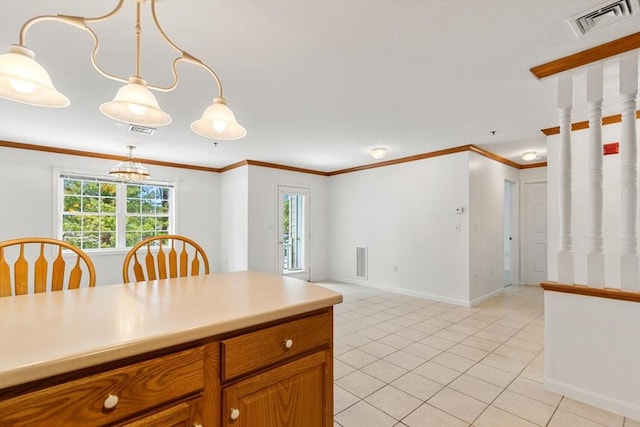 kitchen with plenty of natural light, visible vents, and crown molding