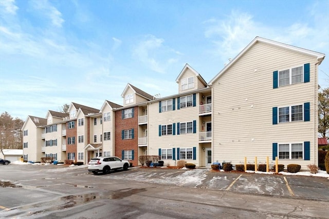 view of property with uncovered parking