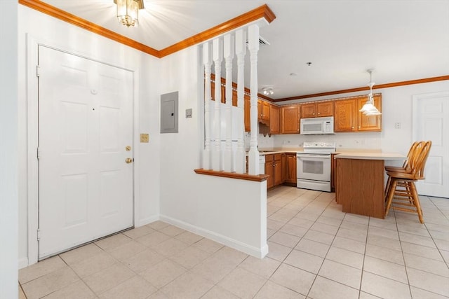 kitchen featuring white appliances, brown cabinetry, a peninsula, electric panel, and light countertops