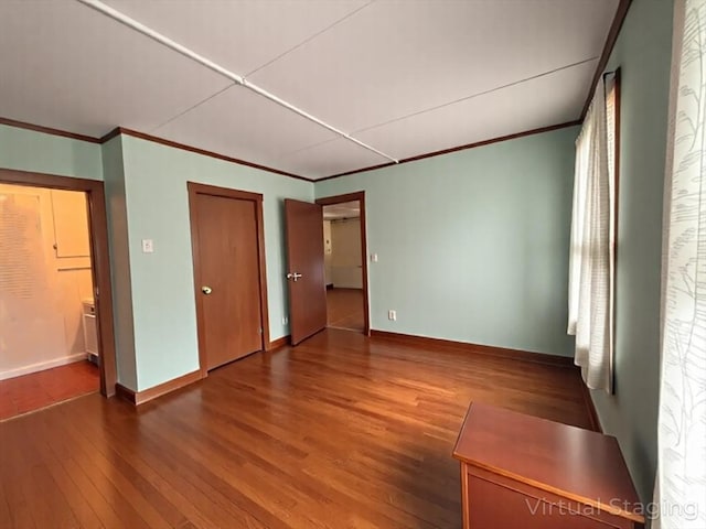 56-58 E Bacon St, Plainville, MA 02762 - unfurnished bedroom featuring wood finished floors, crown molding, and baseboards