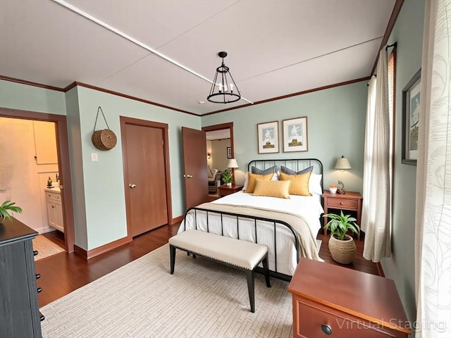 56-58 E Bacon St, Plainville, MA 02762 - bedroom with wood finished floors, ornamental molding, and baseboards
