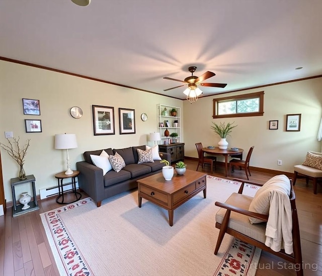 56-58 E Bacon St, Plainville, MA 02762 - living area with ceiling fan, light wood-style flooring, a baseboard heating unit, ornamental molding, and baseboards