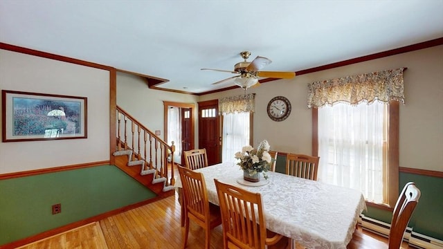 56-58 E Bacon St, Plainville, MA 02762 - dining room featuring plenty of natural light, ceiling fan, baseboard heating, stairs, and ornamental molding