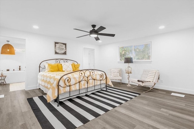 bedroom with dark wood-type flooring and ceiling fan