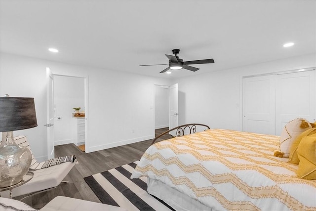 bedroom with ceiling fan, dark hardwood / wood-style flooring, and a closet