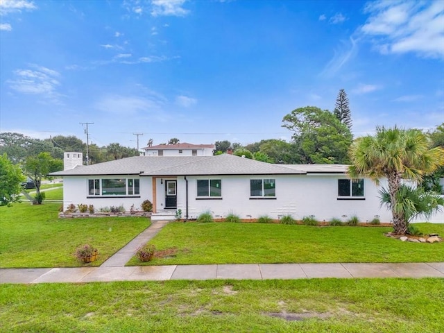 ranch-style home featuring a front yard